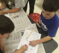 Jeffrey and Quincy identify a bone from a pellet
