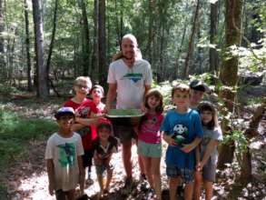 Joseph and the campers collecting wild edibles!