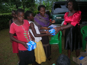Girls receiving their sanitary pads