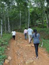 Staff walking up a mountain path for the research