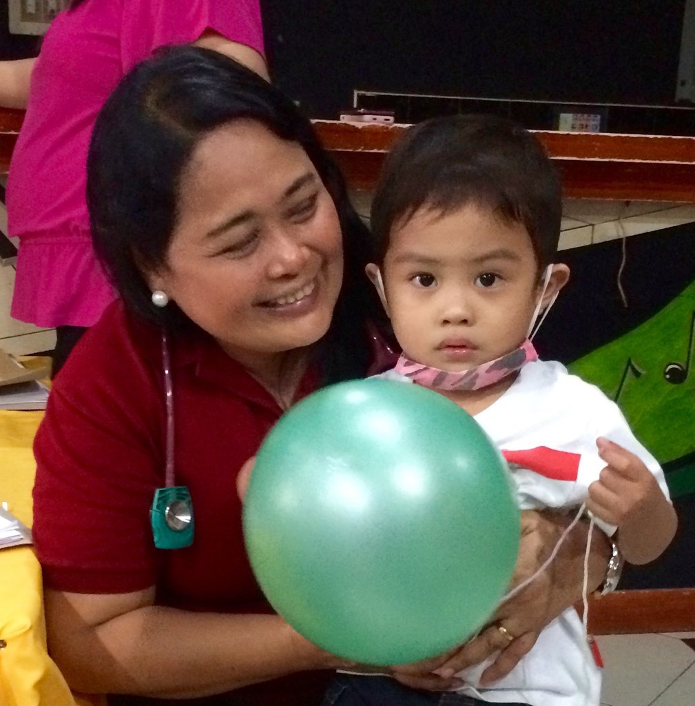 Project Lead Dr. Dolendo with a patient