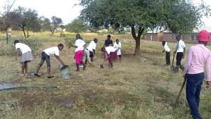 Maranatha students&beneficiaries clearing the land