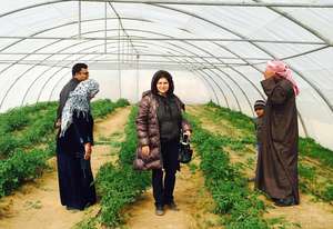 Yanar Mohammed(center) leader of OWFI at the farm.