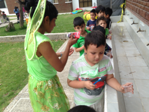 Aracelly as the Tooth Fairy instructing children