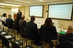 judges listening to student presentations