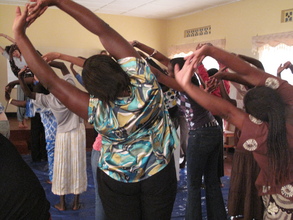 Rwandan women doing yoga