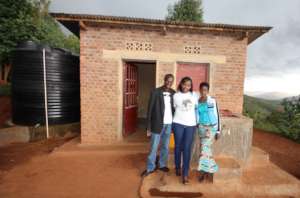 2 of Vision's leaders with one of our local staff