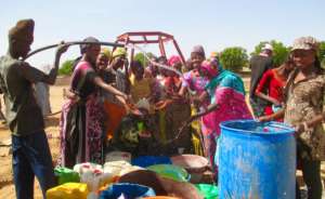 Women rejoice as they taste water from the well