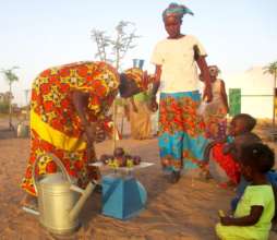Women in Gagnick Mack weigh their eggplant harvest