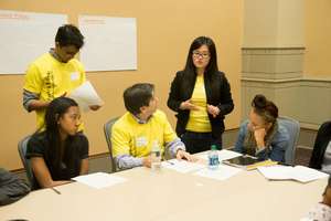 EY volunteers working with NFTE students
