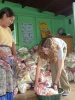 Volunteers help to distribute the parcels