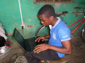 Simon with his new laptop