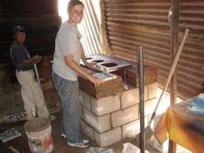 GVI volunteer helping in family home