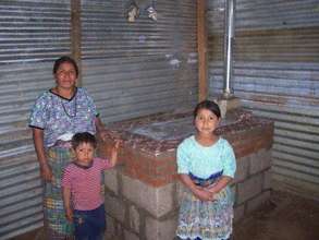 Catalina's family with their finished stove