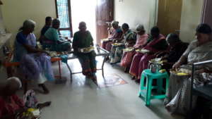 Oldagehome elderly women feeding by Charity Donati