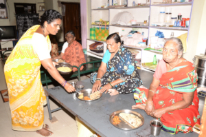 Senior Citizens having food at seruds old age home
