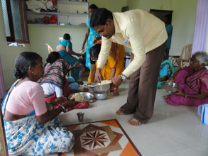 destitute elderly women having nutritious lunch