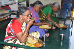old age home elderly people having food in india