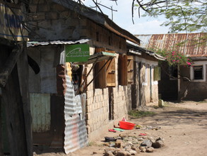 Typical slum dwelling. Note the Safaricom for sale