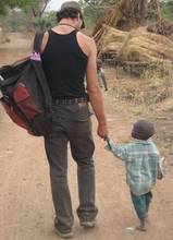 Colin leading a young friend home.