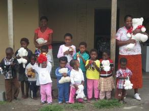 Some children attending our kindergarten with a teacher