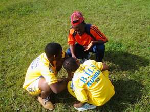 Youth Learn from one of the Coaches in Training