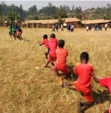 The children playing tug of war