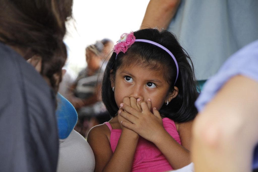 Shy but trusting; a little girl talks to our docs