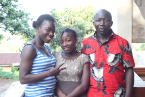 Geraldine, Dorcas and Joshua - outside the Home