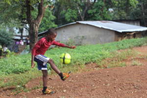 Dream Home boy plays with soccer ball