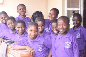 Kids outside Dream Home in uniform
