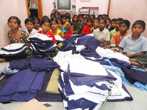 Orphan Children receiving branded uniforms