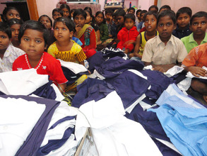 deprived children receiving new school uniforms