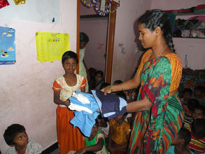 girl children receiving new uniforms joy orphanage