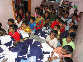 joyhome orphanage children receiving new uniforms
