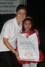 Staff Member Oanh and a Scholarship Recipient
