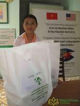 A proud student shows off her scholarship package