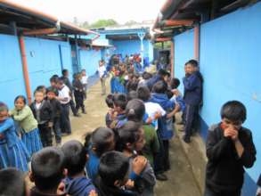 Long queues to give their teacher a hug