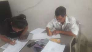 Daughter teaching literacy to her own father