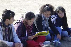 Young girl reading violence prevention manual