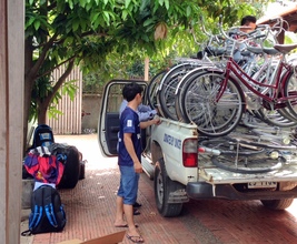 Loading bicycles for volunteers in Kampong Thom