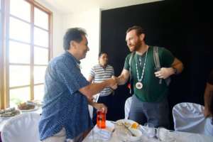 Andrew Quitmeyer shake hands w/  FU President