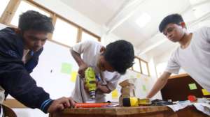 Students constructing an instrument