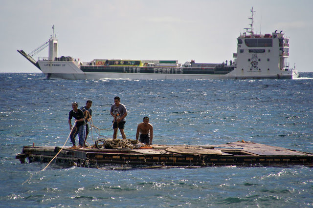 Zorich Guia and workers securing the rope