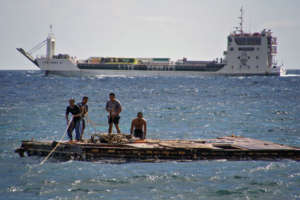 Zorich Guia and workers securing the rope