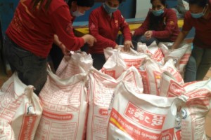 Preparing food packages to give out to families