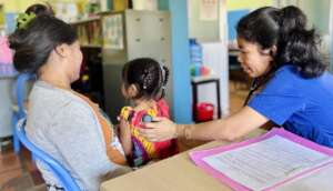 Dr. Dora assessing a patient