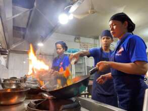 Cookery student learning the ropes on the stove