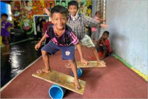 Young boys practicing their Rola-Bola skills