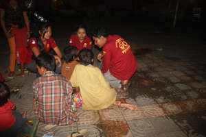 Outreach Team working night time meeting children